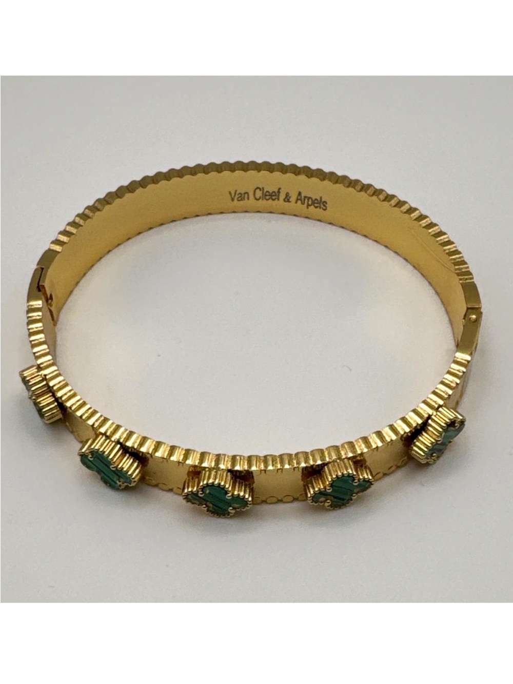 Van Cleef & Arpels Gold Bracelet with Green Stone Motifs